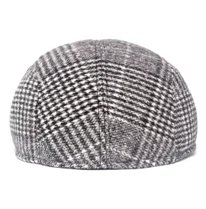 Rear view of wool blend newsboy hat with grey and black houndstooth pattern detail
