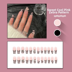 Pink and black zebra stripe press-on nails set with rhinestone accents in French style