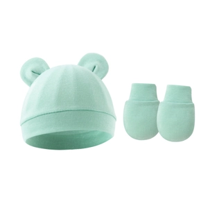Detail of light green baby beanie with ears and matching anti-scratch mittens set