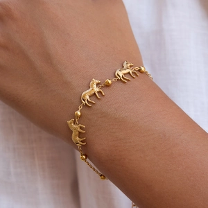 Elegant 18k gold plated stainless steel bracelet with three zebra charms for women