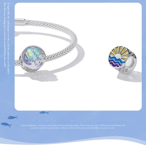 Detail of S925 silver mesh bracelet with colorful aurora star and enamel wave charms