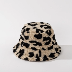 Close-up of leopard print fluffy faux fur bucket hat with soft winter plush texture