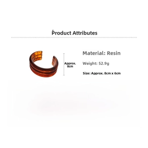 Detail view of resin cuff bangle with tortoiseshell pattern and 8cm by 6cm dimensions