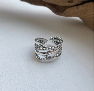 Detail view of 925 sterling silver multilayer ring with vintage beaded texture