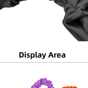 Detailed view of pleated satin headbands in black, purple, and orange colors
