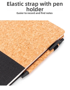 Detail of A5 cork notebook featuring elastic closure band and matching pen holder slot