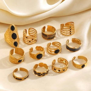 12-piece set of 18K gold-plated stainless steel rings with black enamel accents and textures