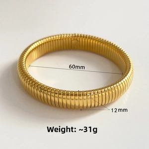 Detailed view of gold stainless steel ribbed cuff bracelet measuring 60mm by 12mm