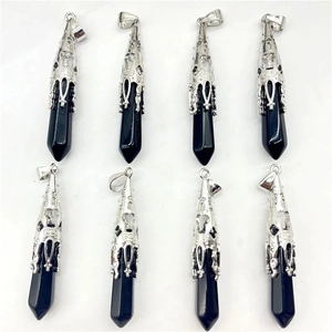 Detail of eight obsidian hexagonal point pendants with ornate silver filigree metal caps