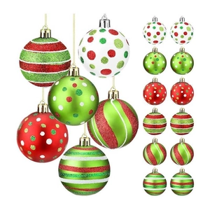 Macro shot of red and green festive Christmas balls with glitter and stripe patterns