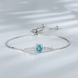 Detailed close-up of a 925 silver bracelet featuring a square light blue gemstone inlay
