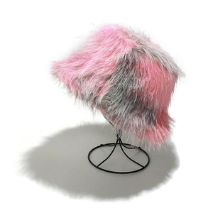 Winter faux fur bucket hat with pink and grey fuzzy fibers on a metal stand