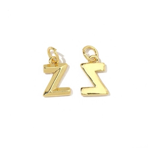 Close-up of polished 18K gold-plated letter Z charms with zircon for DIY jewelry