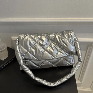 Silver quilted padded underarm bag with metallic finish and minimalist chic style
