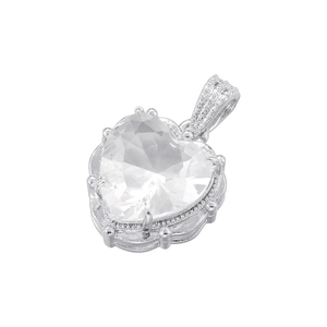 Macro detail of silver heart pendant featuring a large clear crystal and beaded bezel