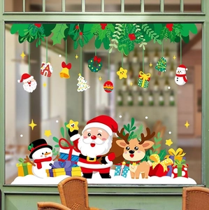Detailed Christmas window decals featuring Santa, reindeer, and colorful gift boxes on glass