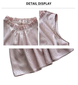 Detailed view of pink satin sleeveless top featuring a ruffled neckline and leopard print