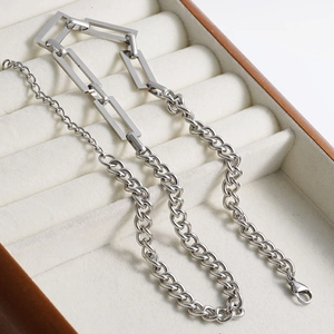 Detail of silver stainless steel geometric rectangle link and curb chain necklace
