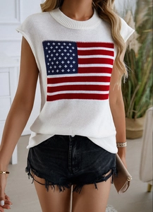 Detail of a white knit sleeveless top featuring a vibrant American flag print for women