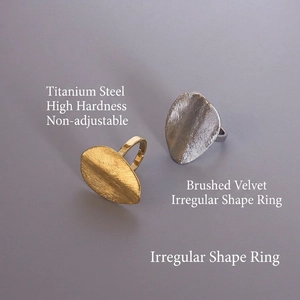 Brushed matte titanium steel rings in gold and silver with irregular oval design