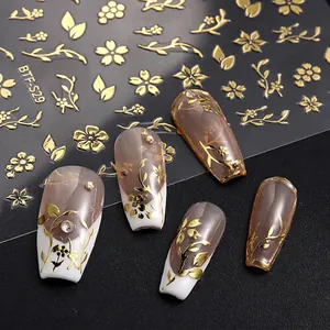 Japanese style golden flower nail stickers with 3D embossed floral patterns on black background