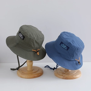 Outdoor quick-dry bucket hat for kids with adjustable chin strap and breathable fabric