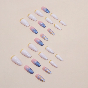 Long coffin press-on nails set with yellow tips, blue glitter, and floral art designs
