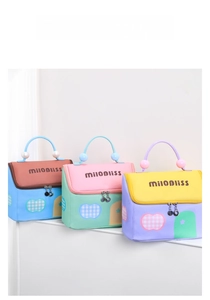 Three multi-color portable cosmetic bags with pearl handles and zipper closure in a group view
