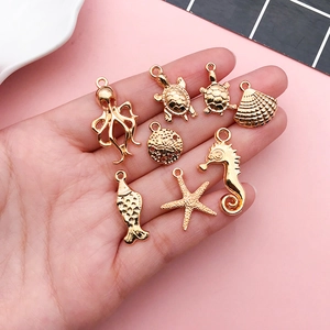 Golden zinc alloy sea life charms featuring turtle shell and seahorse for DIY jewelry