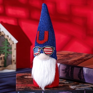 Detail of patriotic gnome plush with American flag glasses and blue knitted hat