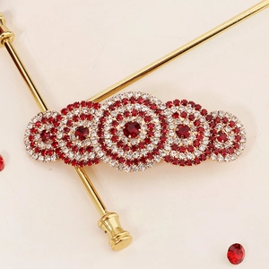 Luxury Korean bow hair clip with red and white rhinestones on a gold metal claw chain