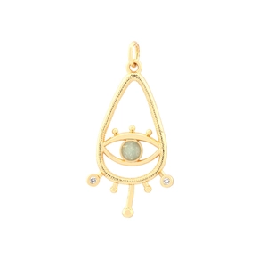 Macro detail of gold teardrop evil eye charm with inlaid green and clear gemstones