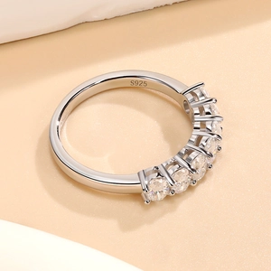 Elegant S925 sterling silver ring featuring seven round cut moissanite stones in a row