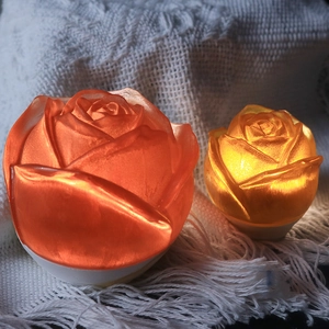Detail of rose-shaped LED night light with warm glow and delicate petal textures