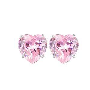 Pink heart-shaped silver stud earrings with zirconia stones in a three-prong setting