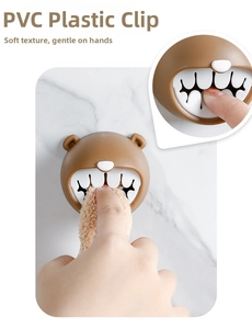 Detail of cute brown bear towel holder showing soft PVC material and non-drill mount