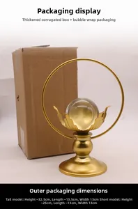 Detailed size comparison of tall and short crystal ball ornaments with golden leaf bases