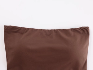 Detailed view of the elastic edge and soft jersey fabric of the brown tube top