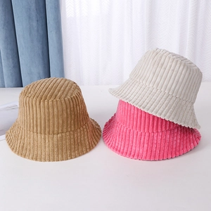 Three corduroy bucket hats in khaki pink and beige displayed on a simple background