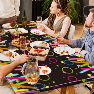 Neon paint splash graffiti pattern detail on navy blue disposable party tablecloth