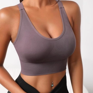 Seamless purple yoga bra with wide straps and breathable mesh for athletic support