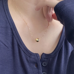 Minimalist S925 sterling silver necklace with 10mm gold round bead pendant on model