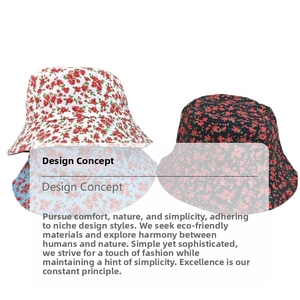 Detail of floral bucket hats in white and black with red flower prints and cotton fabric