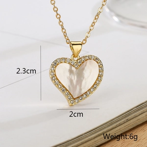 Detailed macro view of 18K gold-plated heart pendant with mother of pearl and zircons