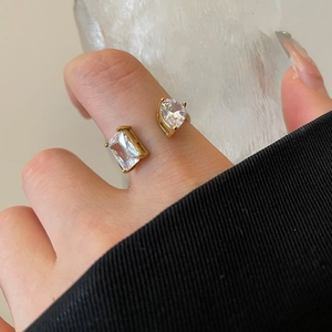 Detail of 18k gold plated stainless steel teardrop ring with white cubic zirconia stones