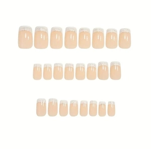Detailed set of 24 classic white French press-on nails with silver glitter tips