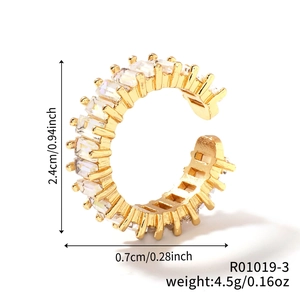 Macro shot of gold-plated C-shaped ring with rectangle zircons and size specifications