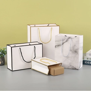Various sizes of premium paper gift bags with marble patterns and rope handles