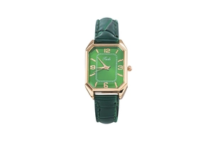 Detailed macro of vintage green square watch dial with gold case and leather strap