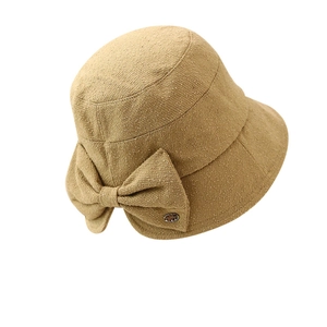Khaki textured fabric bucket hat with a stylish side bow and metal accent decoration